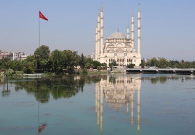ADANA,TURKEY-AUGUST 29:Reflections of The Sabanci Central Mosque on The River Seyhan.August 29,2022 in Adana,Turkey.