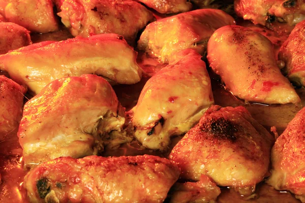 Chicken thighs inside oven — Stock Photo, Image