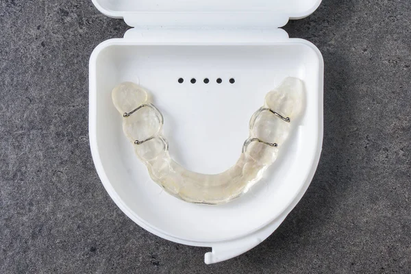 A dental splint, a device made for occlusion problems, bruxism or as retainer after braces.