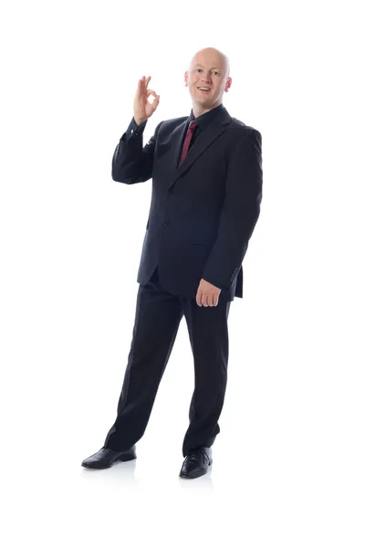 Muž v obleku ok znamení — Stock fotografie