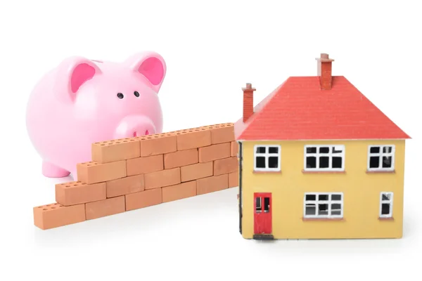 Piggy bank and house — Stock Photo, Image