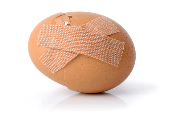 An egg with plasters — Stock Photo, Image