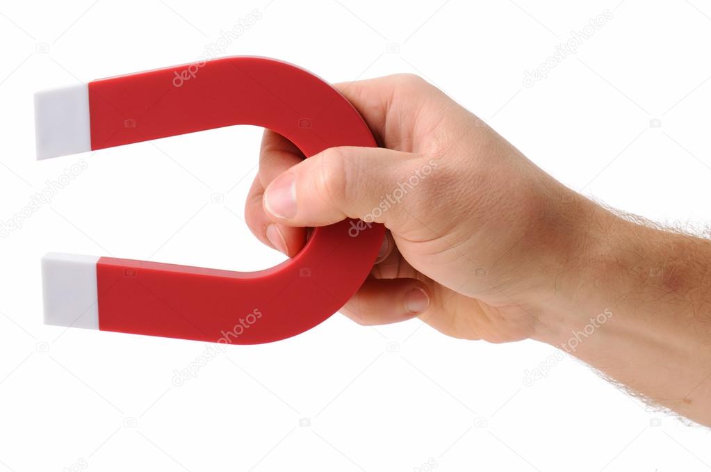 Hand holding magnet