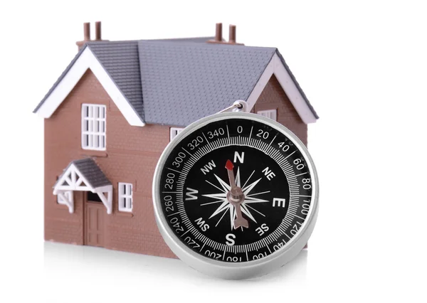 A compass with small house — Stock Photo, Image