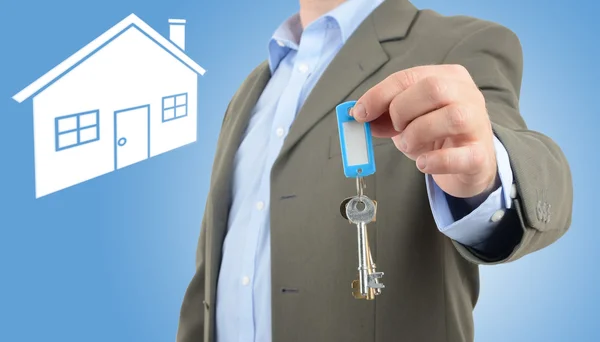 Man offering keys — Stock Photo, Image