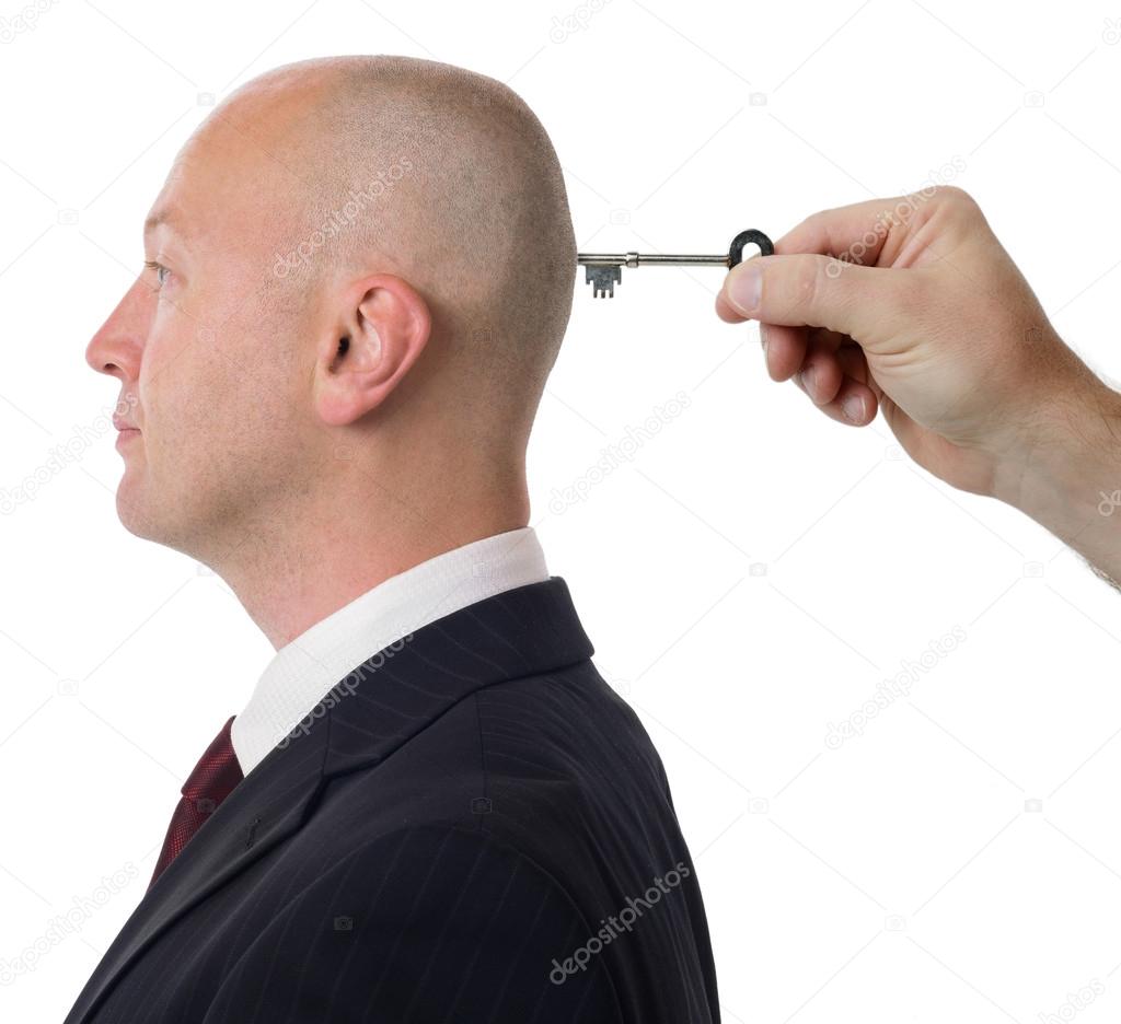 Man with key in head