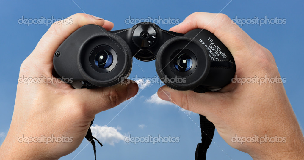 Hands holding binoculars Stock Photo by ©hyrons 51172841