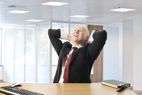 Businessman relaxing after successful day — Stock Photo, Image