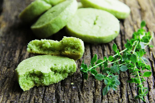 Parmesan biscuits with tea match and thyme. — Stock Photo, Image