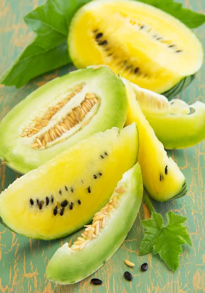Yellow watermelon and green melon. — Stock Photo, Image