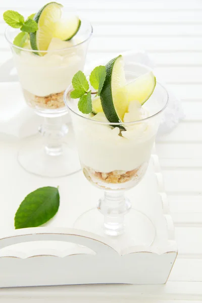 Cheesecake with lime in a glass. Selective focus. — Stock Photo, Image
