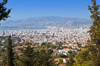 Volos city as it is seen from Portaria of Pelion in Greece clipart