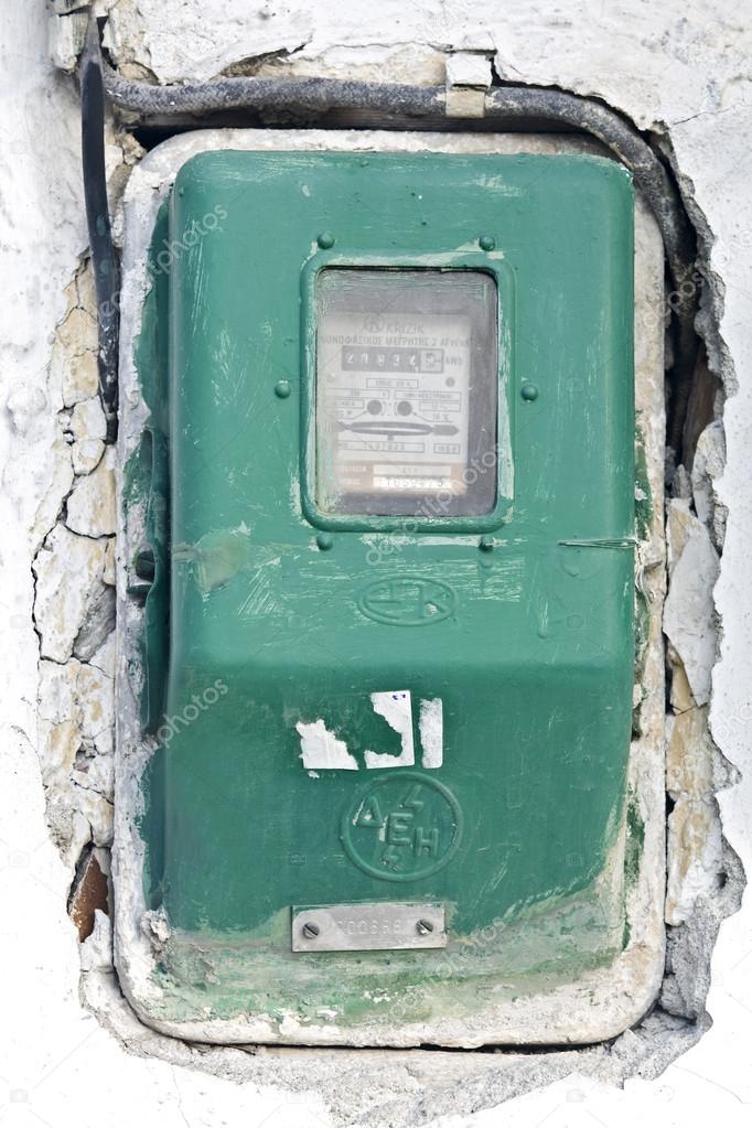 Old electric meter on a wall