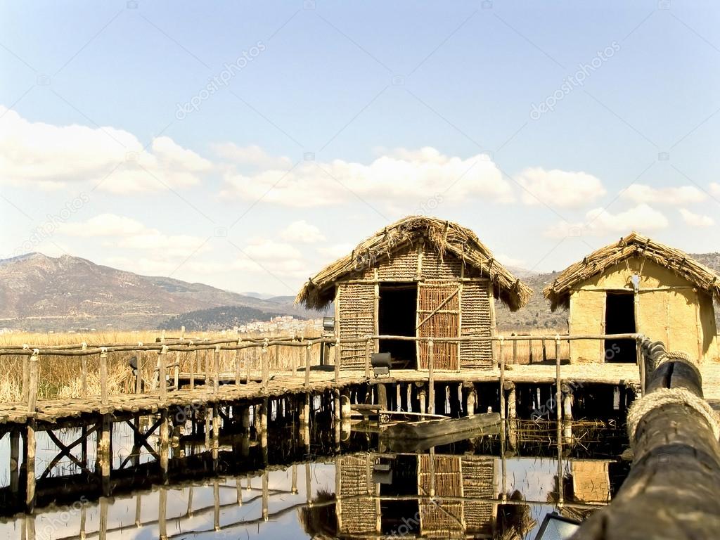 Thatched cottage lake settlement