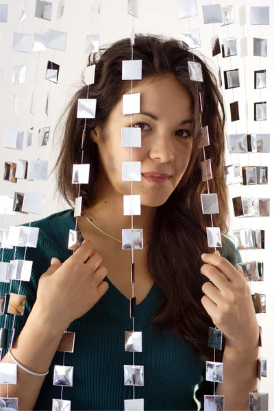 Woman behind mirrored beads — Stock Photo, Image