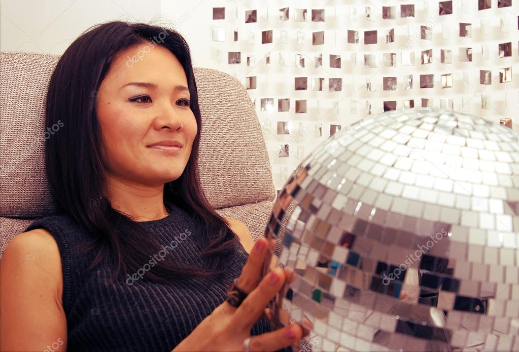 japanese woman holds glitterball