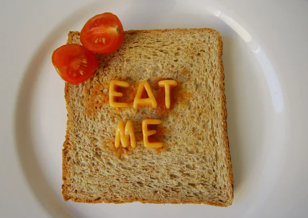 Eat me words on toast — Stock Photo, Image