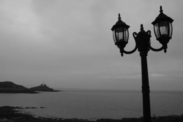 Moody coastal lampposts — Stock Photo, Image