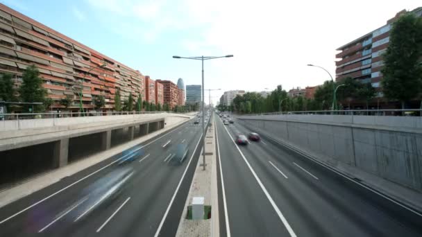 Panning timelapse nighttime traffic shot from a bridge in barcelona spain — Stock Video