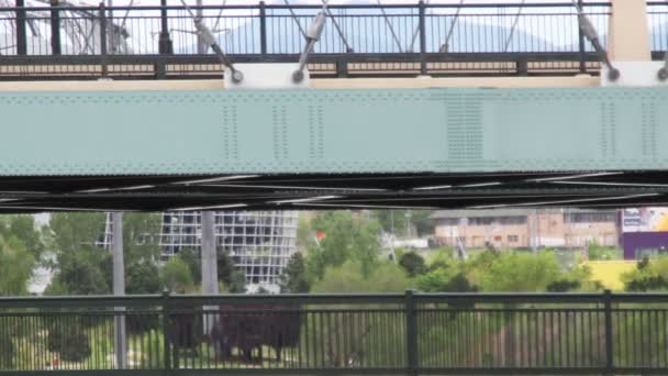 View of pedestrian bridge and vehicle bridge in backgroud, denver, colorado — Stock Video