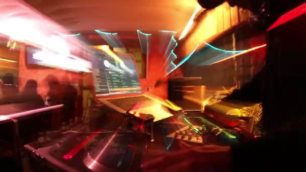 Cool dj behind the turntables performing in a bar — Stock Video