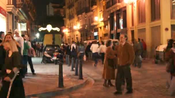 Crowds walking down a street during la fallas festival — Stock Video