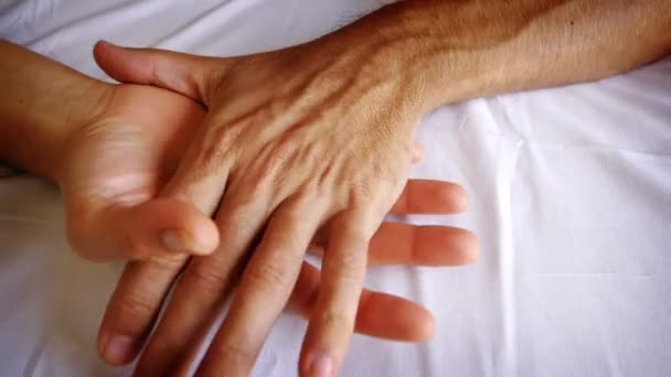 A male and female caressing each other's hands — Stock Video