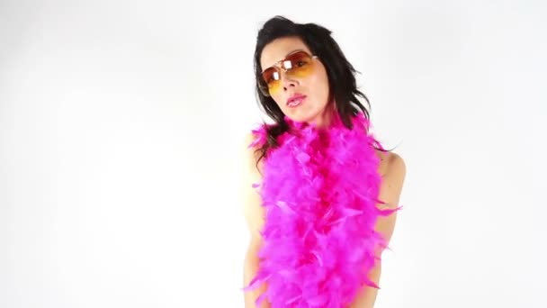 A super sexy woman dances and teases covered with a bright pink boa — Stock Video