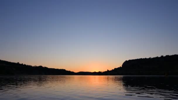 Timelapse of sun setting over a lake in france — Stock Video