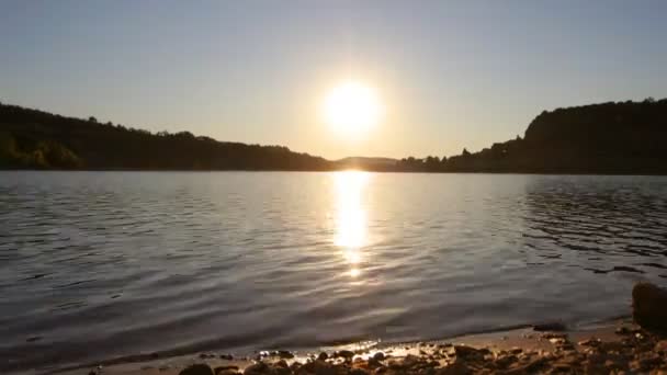 Timelapse of sun setting over a lake in france — Stock Video