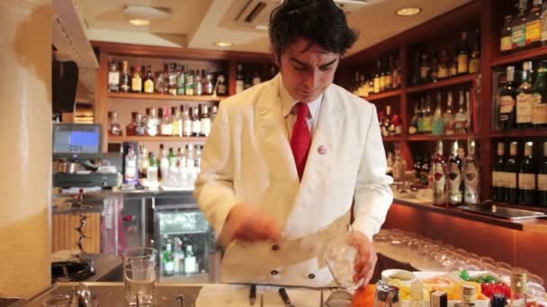 A male cocktail waiter in a classic looking cocktail bar — Stock Video