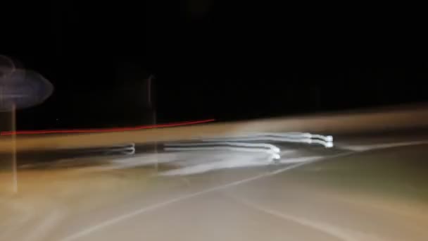 Long exposed nightime timelapse shot from a moving ca — Stock Video