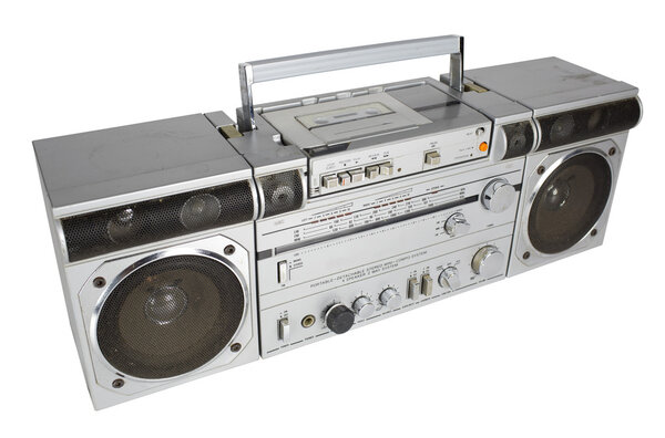 A vintage tape player and radio against black