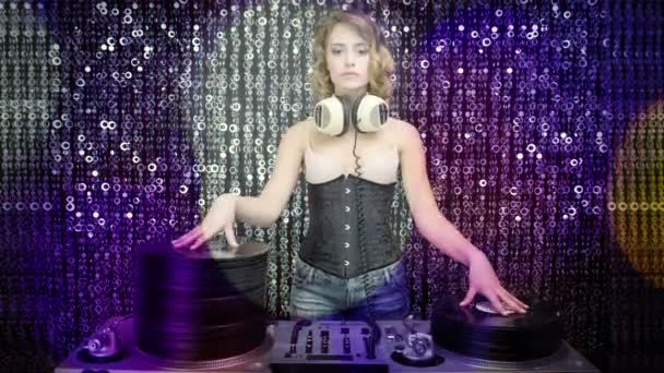 Female dj with pile of vinyl records — Stock Video