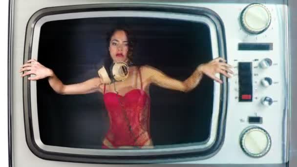 Woman dancing stuck inside retro television