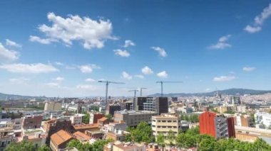 Barcelona skyline timelapse with passing clouds