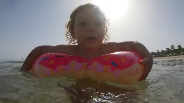 Small Girl Floating Swimming Inflatable Ring Sea — Stock Video