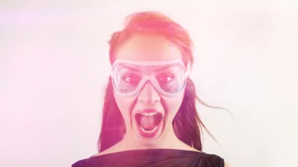 Pretty Woman Wearing Retro Goggles Making Faces — Vídeo de stock