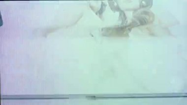 Two beautiful female disco dancers moving with heavy glitch and distortion