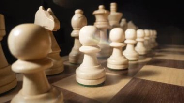 A macro shot of a shadow moving across a chess board