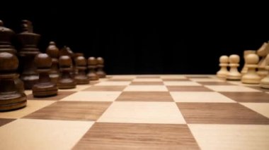 A macro dolly shot snaking along a chess board