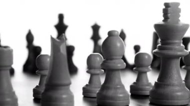 Close up of chess board spinning in black and white