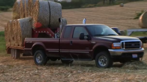 Trucks Hauling Hay Bales — Stock Video