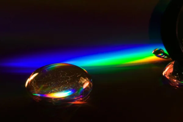 Abstracte regenboog daling in een plastic — Stockfoto