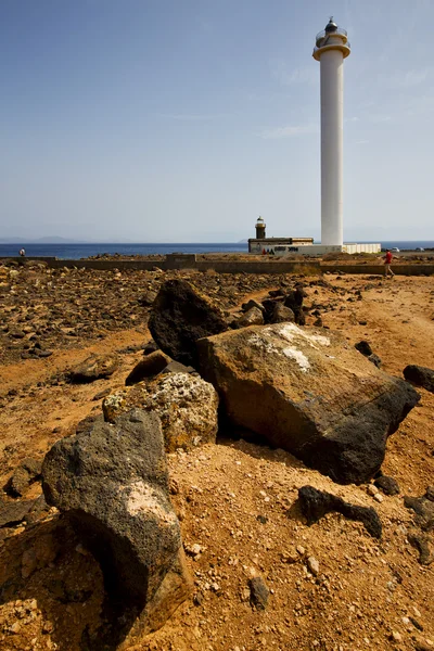 Lighthouse and rock in the blue sky anzarote spain — Stock Photo, Image