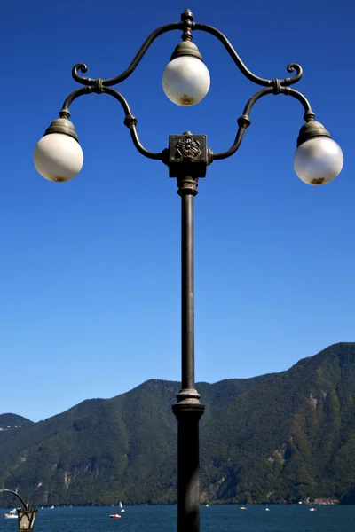 Street lamp a bulb in the sky lake of lugano Switzerland — Stock Photo, Image