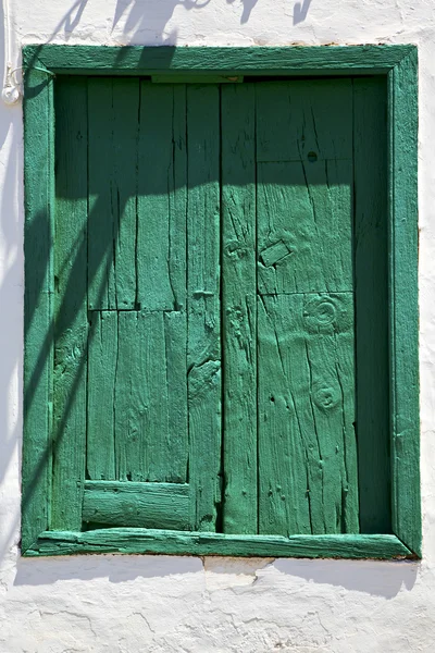 Spain green wood window in a white wall arrecife — Stock Photo, Image