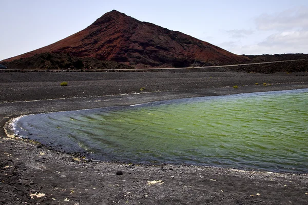 Pierre atlantique océan ciel eau lanzarote dans el golfo — Photo