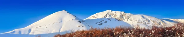 Panorâmica com céu azul Fotos De Bancos De Imagens