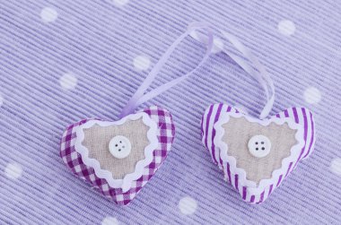 Decorative aroma hearts on lavender background clipart